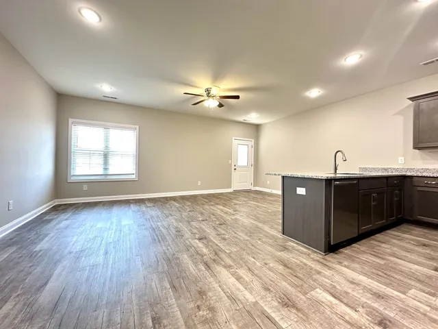 a view of a livingroom with a kitchen
