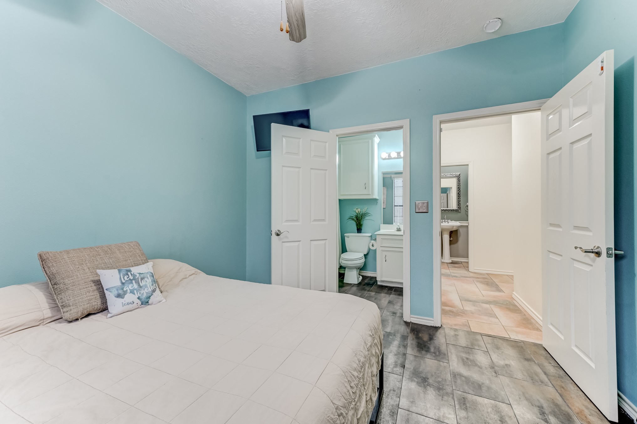 1210 Cherry Creek Road Dayton, TX 77535 - Photo 18 of 50 a bedroom with a bed and a table