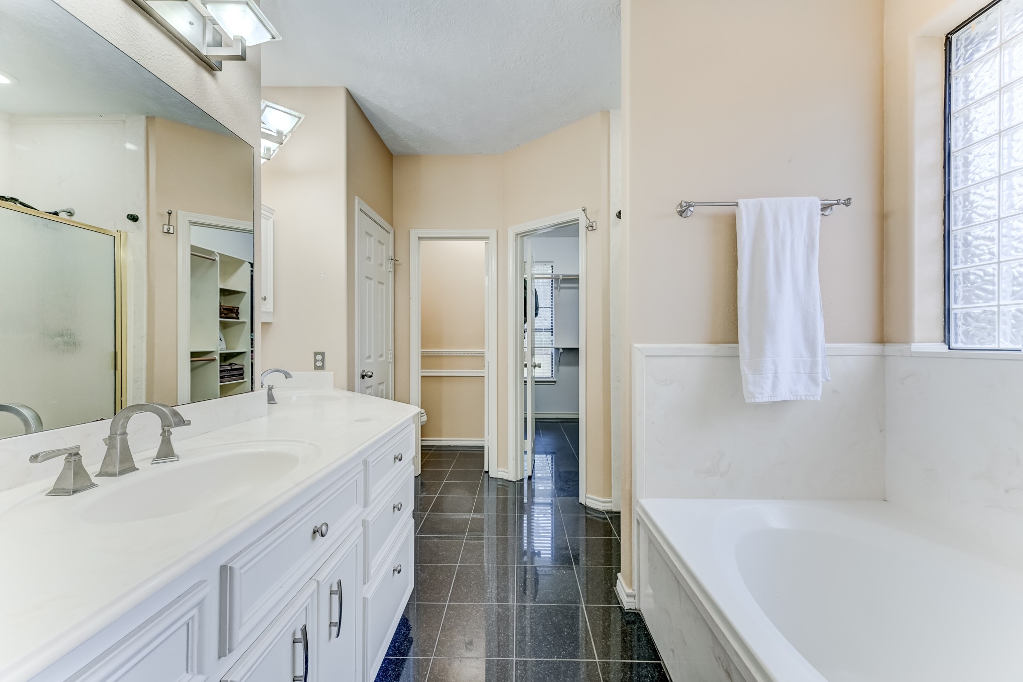1210 Cherry Creek Road Dayton, TX 77535 - Photo 24 of 50 a bathroom with a tub sink shower and two mirror