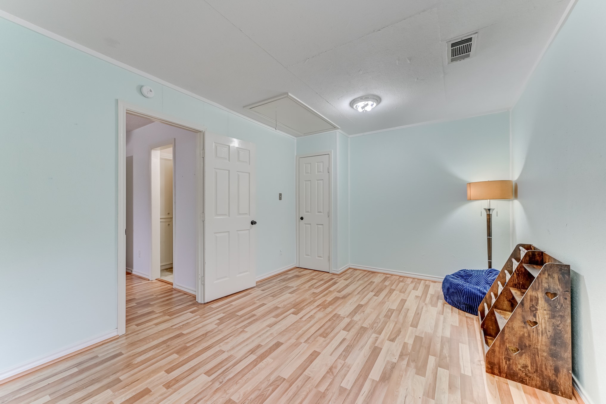 1210 Cherry Creek Road Dayton, TX 77535 - Photo 29 of 50 a bedroom with a bed and a lamp on desk