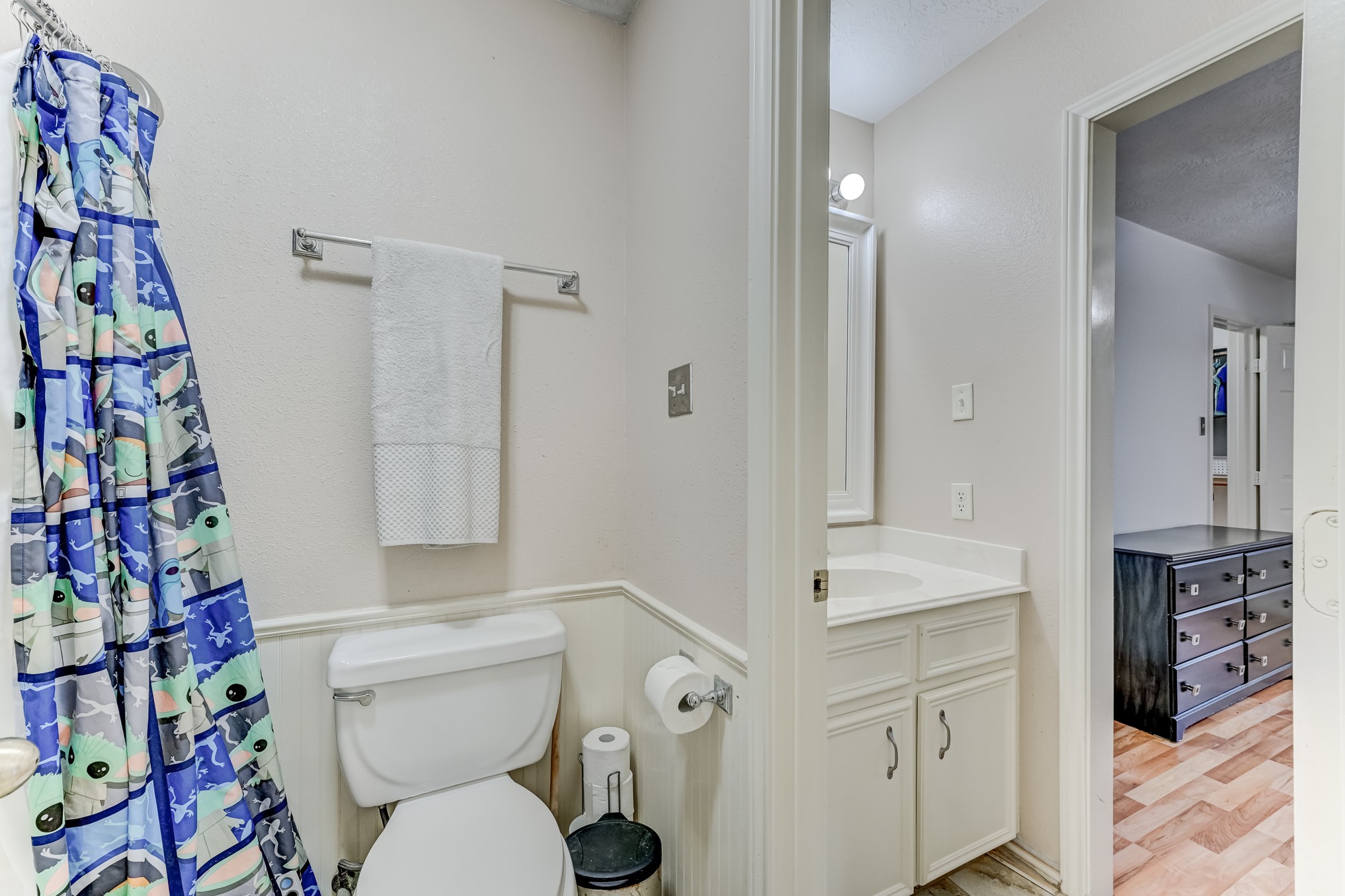 1210 Cherry Creek Road Dayton, TX 77535 - Photo 31 of 50 a white toilet sitting next to a bathroom sink and a mirror