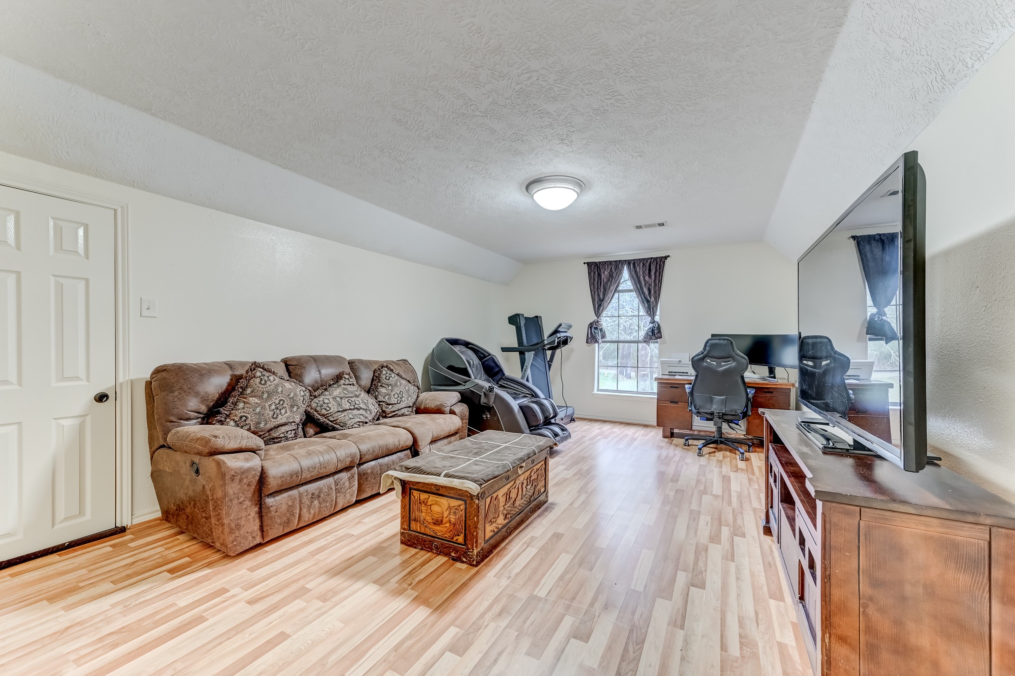 1210 Cherry Creek Road Dayton, TX 77535 - Photo 33 of 50 a living room with furniture and a flat screen tv