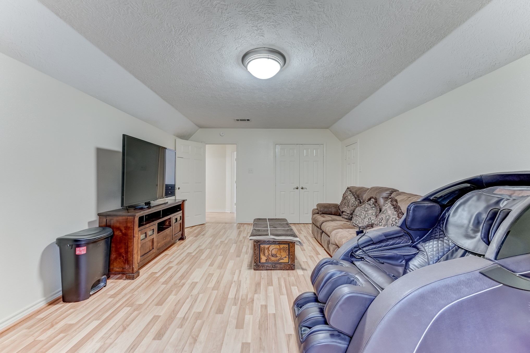 1210 Cherry Creek Road Dayton, TX 77535 - Photo 34 of 50 a living room with furniture and a flat screen tv