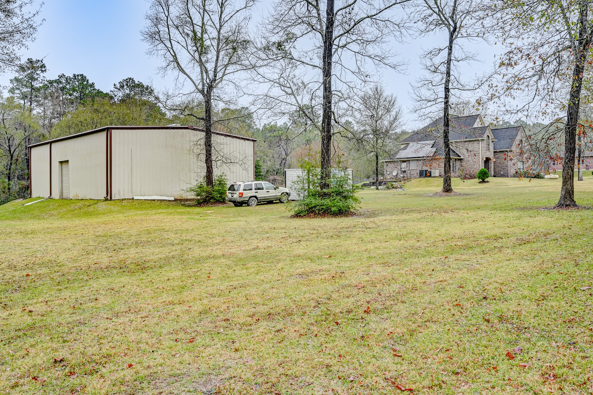 1210 Cherry Creek Road Dayton, TX 77535 - Photo 41 of 50 a view of a large garden with large trees