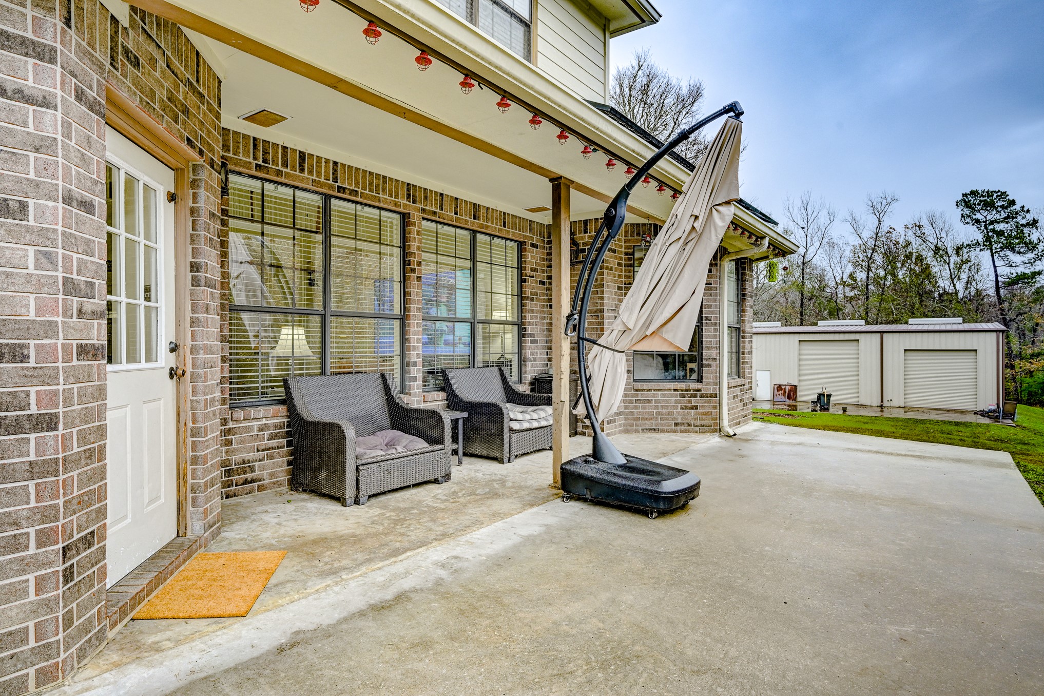 1210 Cherry Creek Road Dayton, TX 77535 - Photo 43 of 50 a view of a patio with a table and chairs