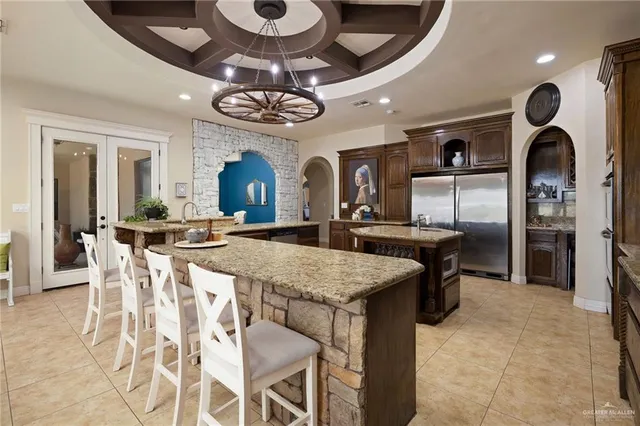 a large kitchen with a table and chairs