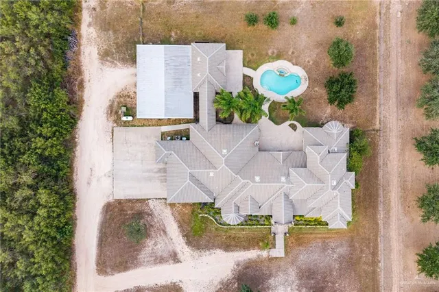 a aerial view of a house with a swimming pool