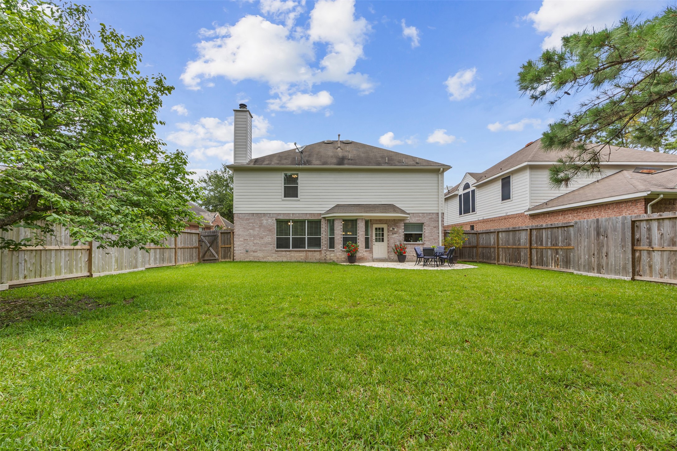 2219 Louetta Brook Lane Spring, TX 77388 - Photo 7 of 34 Expansive backyard with fully fenced yard and plenty of room for activities.