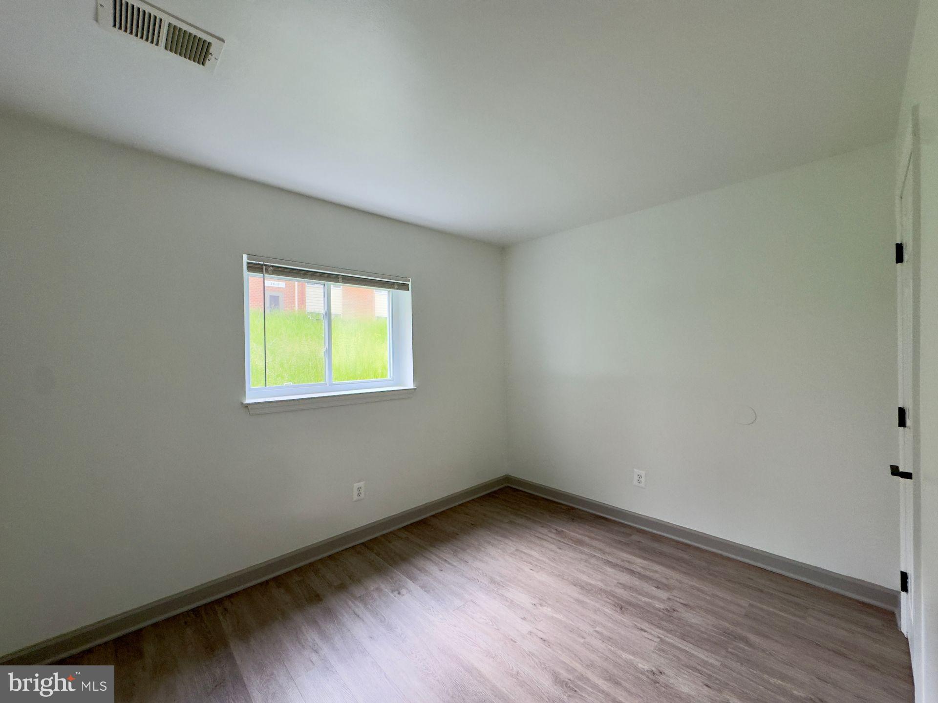 3500 Beech Avenue, Unit 3514A Baltimore, MD 21211 - Photo 4 of 8 an empty room with a window