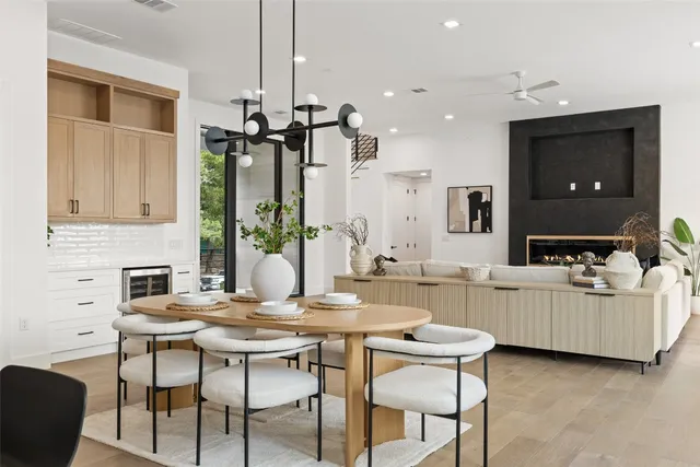 a view of a dining room with furniture and a chandelier