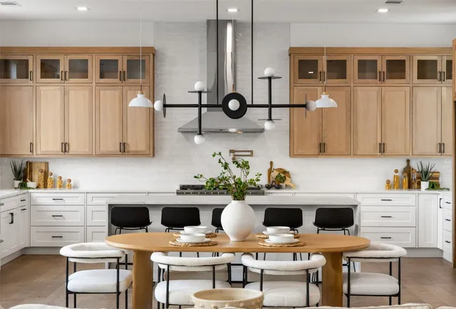 a kitchen with a stove and white cabinets