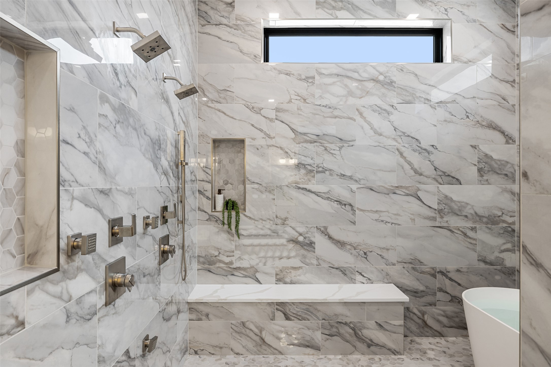 2603 Rockingham Drive Austin, TX 78704 - Photo 20 of 40 Full bath with a marble finish shower, a freestanding bath, and tile walls