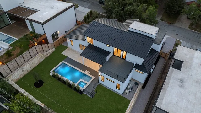 an aerial view of house with yard