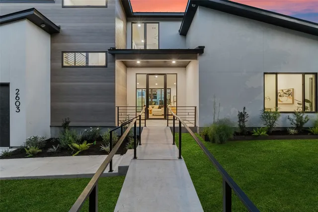 a front view of a house with garden