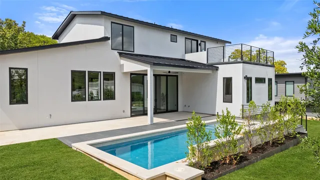 a view of swimming pool with a yard