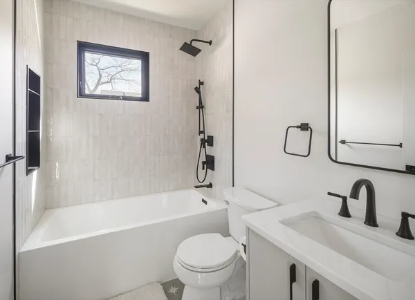 a bathroom with a toilet and a sink