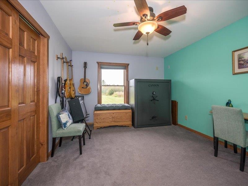 3994 County Rd U South Range, WI 54874 - Photo 29 of 56 Living area featuring carpet and a ceiling fan