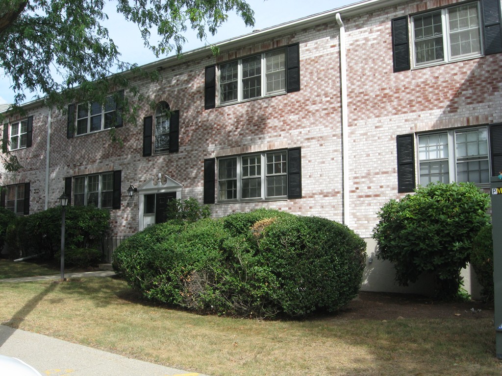 a view of a stone house with a large windows