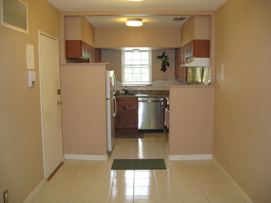 141 Lake Shore Road, Unit 4 Boston, MA 02135 - Photo 3 of 12 a kitchen with refrigerator and window
