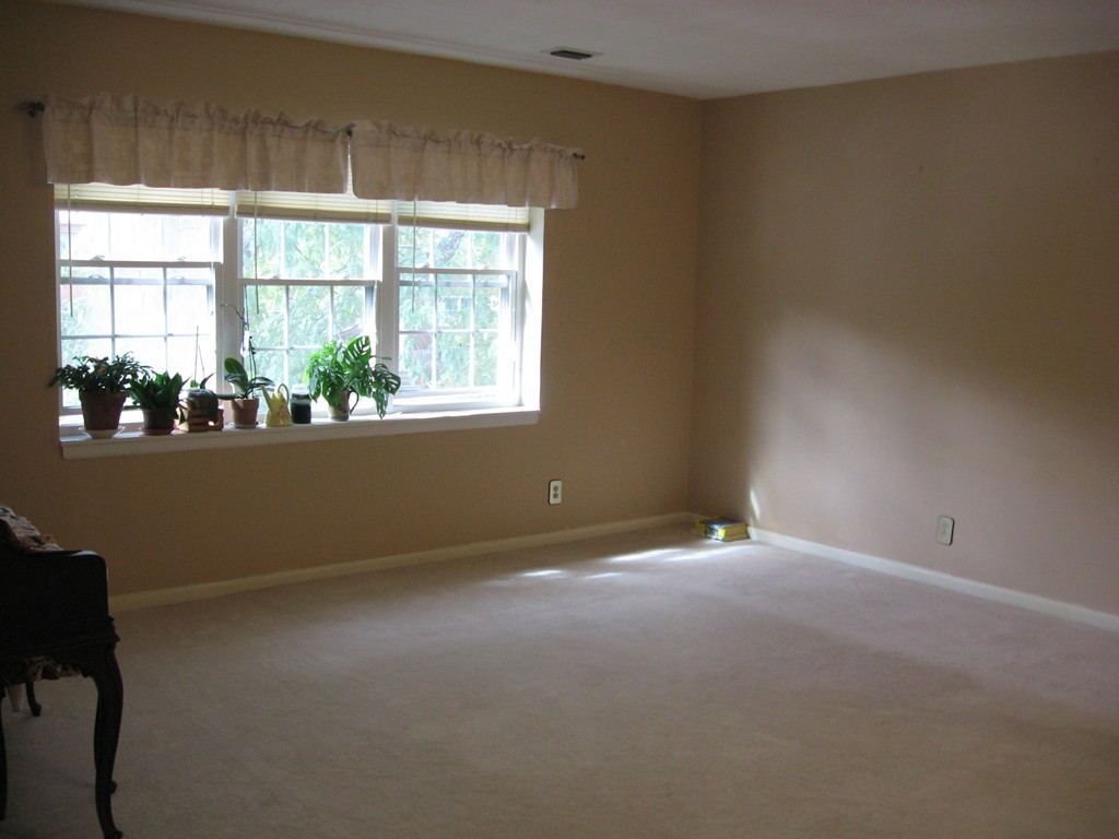 141 Lake Shore Road, Unit 4 Boston, MA 02135 - Photo 4 of 12 an empty room with a window