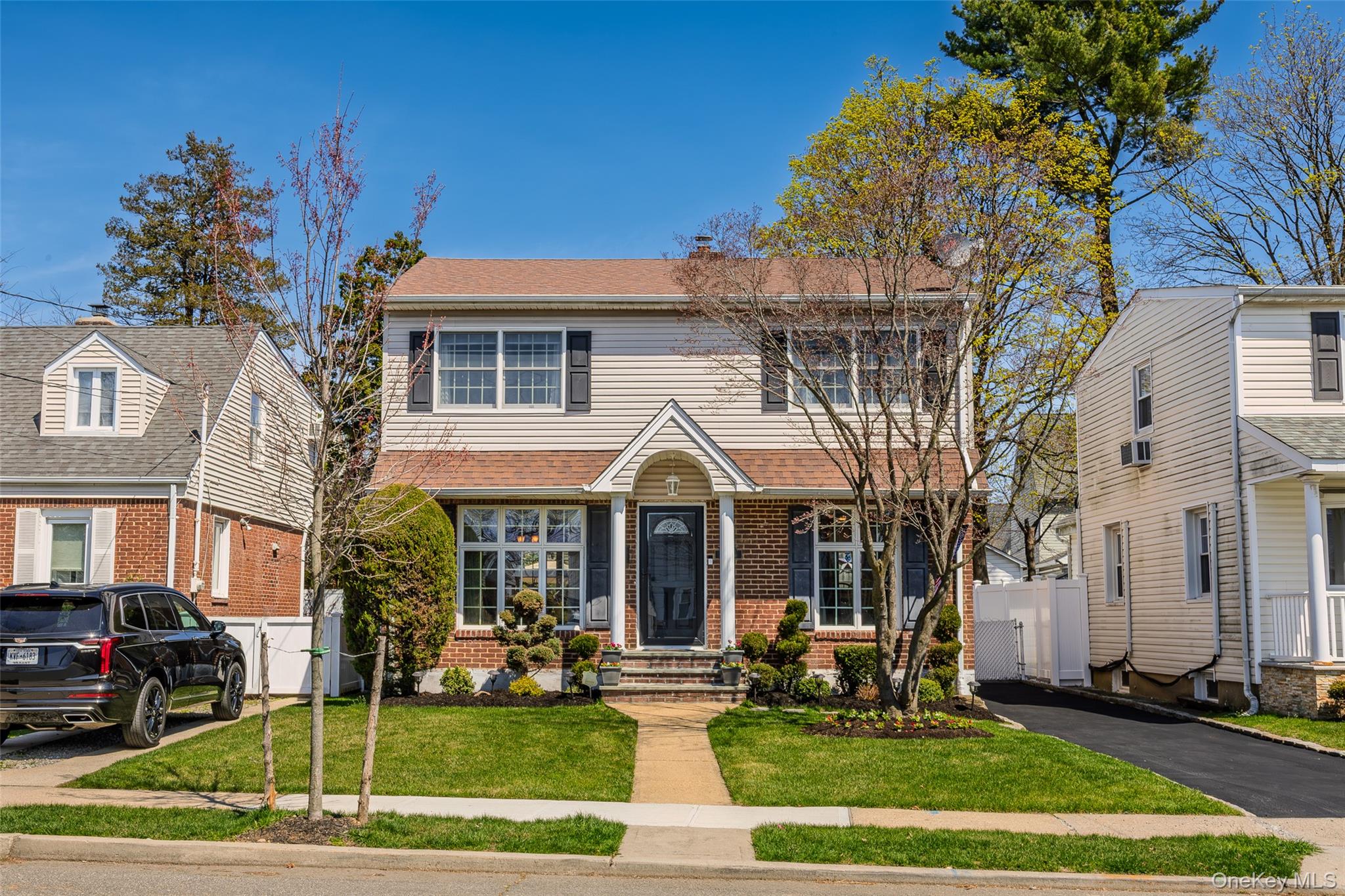 416 Argyle Road Mineola, NY 11501 - Photo 1 of 46 a front view of a house with a yard