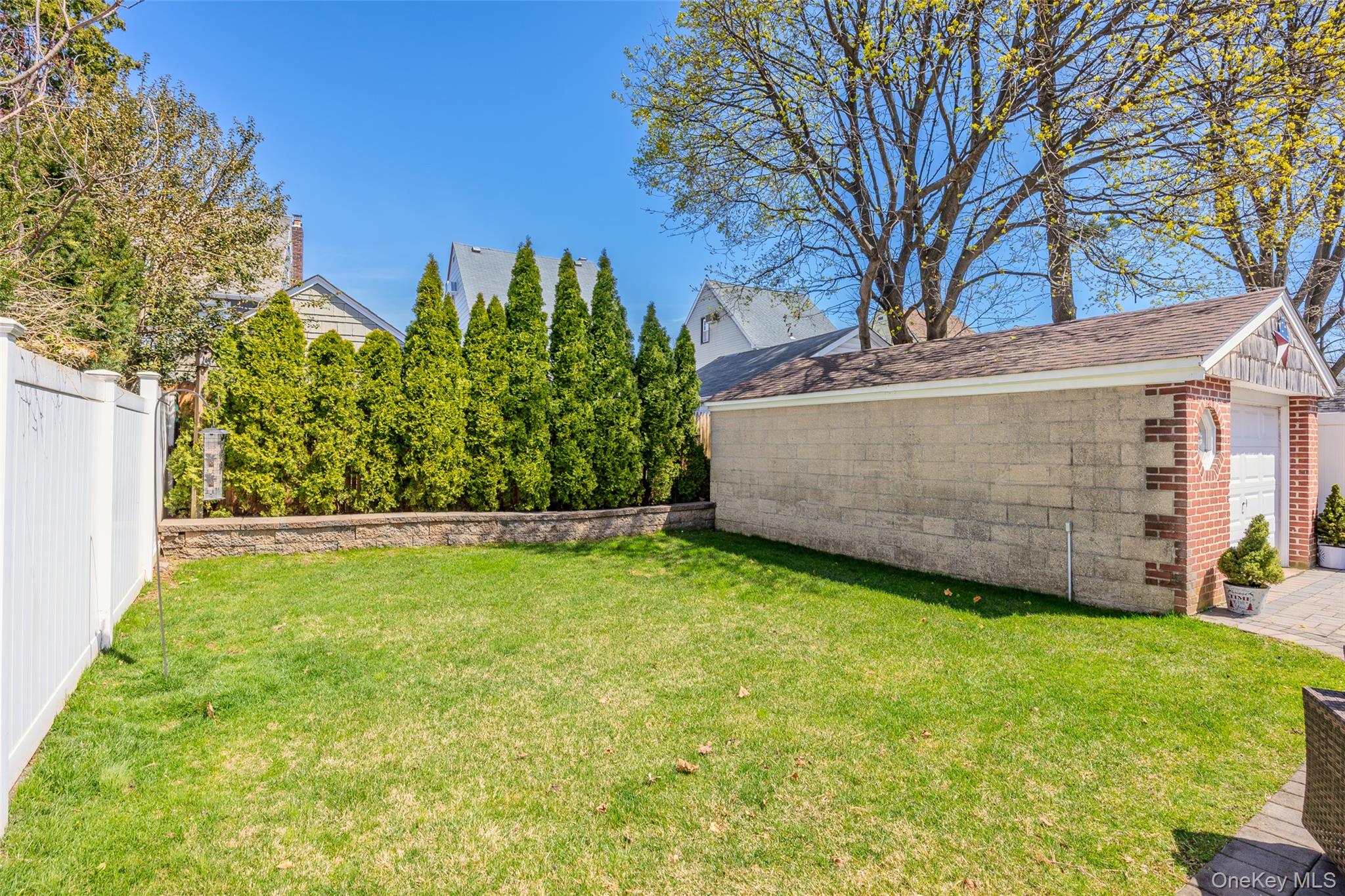 416 Argyle Road Mineola, NY 11501 - Photo 11 of 46 a view of a backyard with large trees