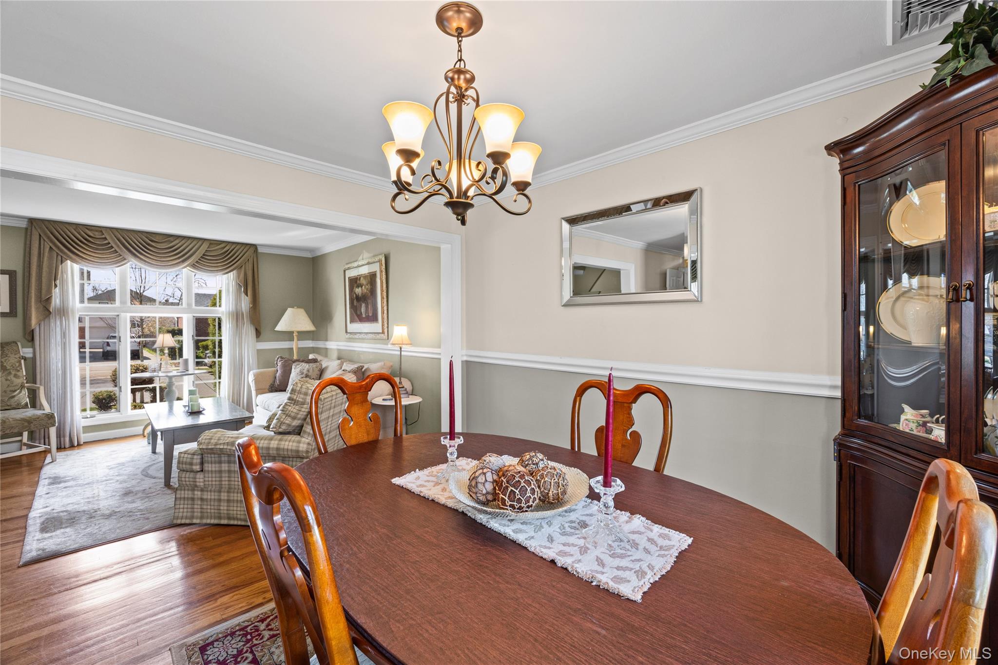 416 Argyle Road Mineola, NY 11501 - Photo 19 of 46 a living room with furniture and a chandelier