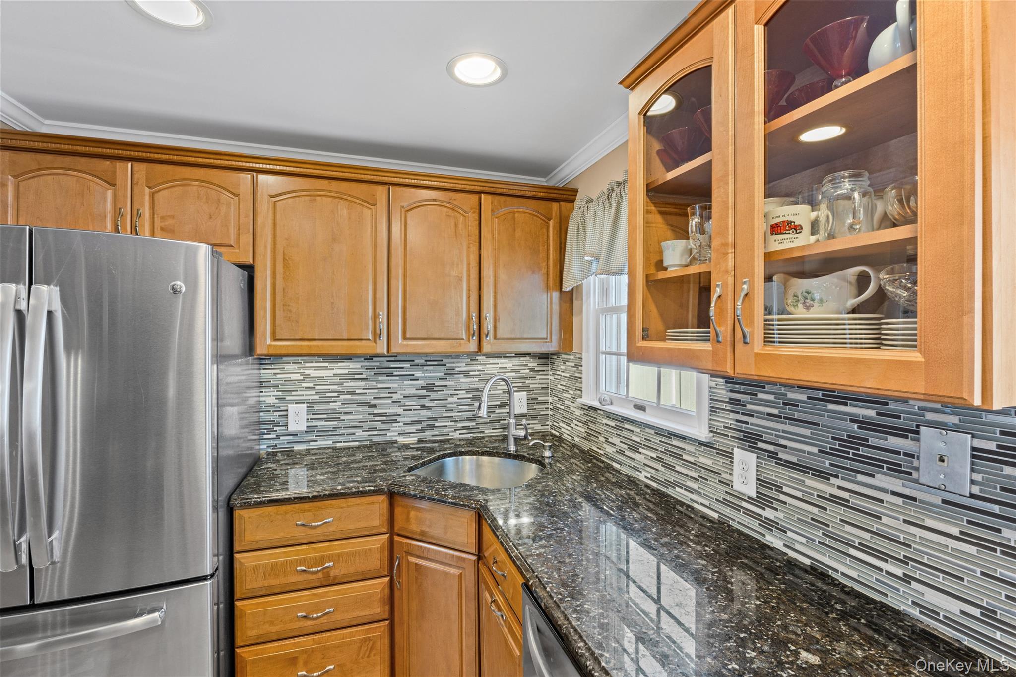 416 Argyle Road Mineola, NY 11501 - Photo 23 of 46 a kitchen with stainless steel appliances granite countertop a refrigerator and a stove