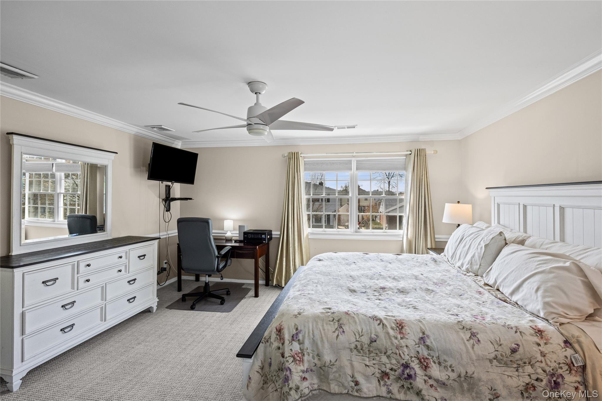 416 Argyle Road Mineola, NY 11501 - Photo 28 of 46 a bedroom with a large bed and wooden floor