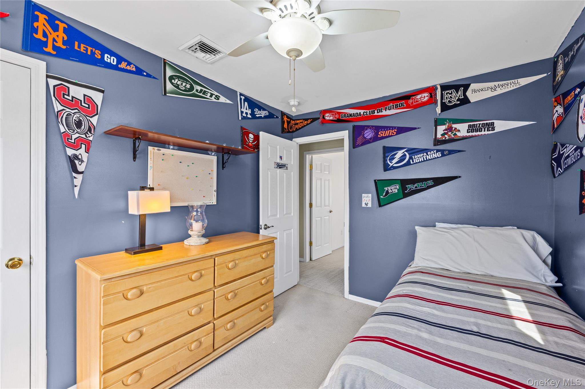 416 Argyle Road Mineola, NY 11501 - Photo 34 of 46 a bedroom with a bed and wooden floor