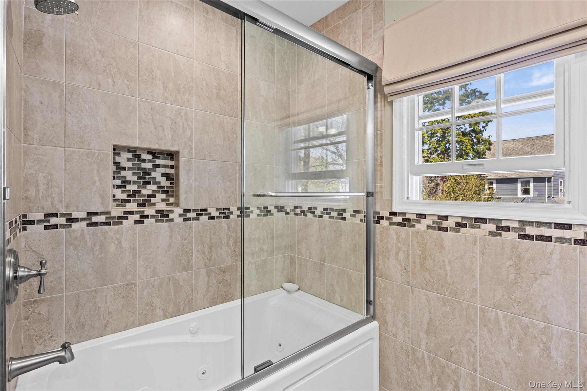 416 Argyle Road Mineola, NY 11501 - Photo 36 of 46 a bathroom with a shower and a bathtub