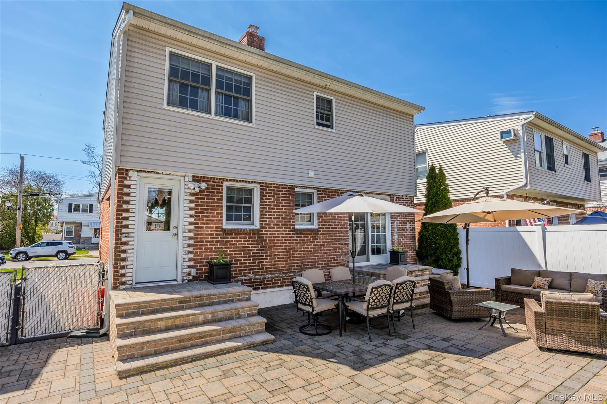 416 Argyle Road Mineola, NY 11501 - Photo 5 of 46 a front view of a house with a patio