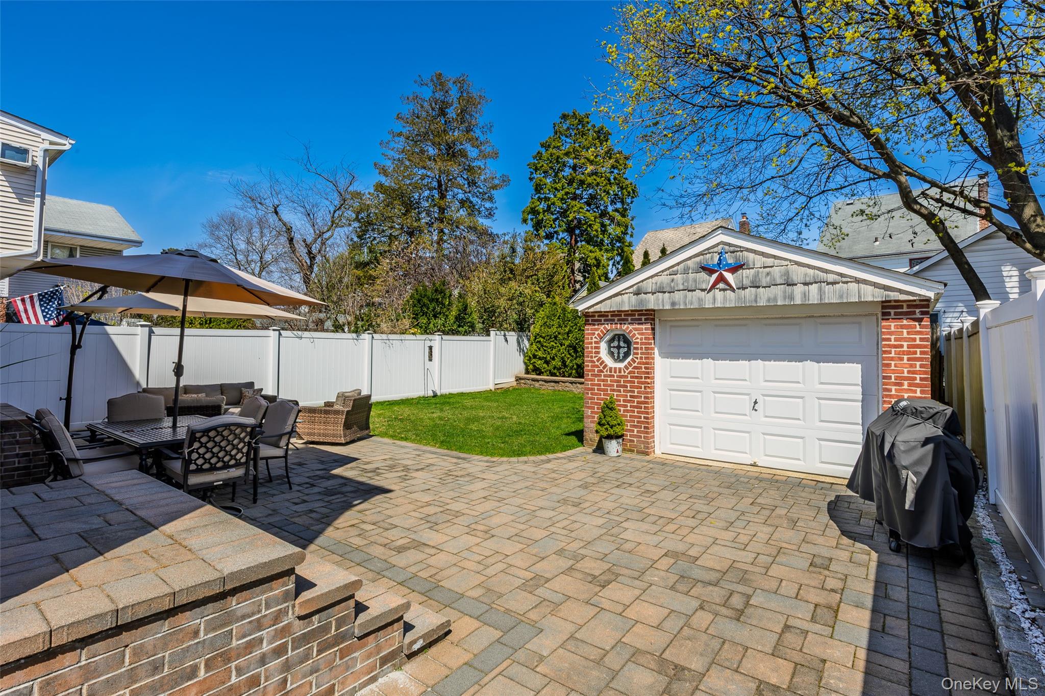 416 Argyle Road Mineola, NY 11501 - Photo 7 of 46 a front view of a house with garden