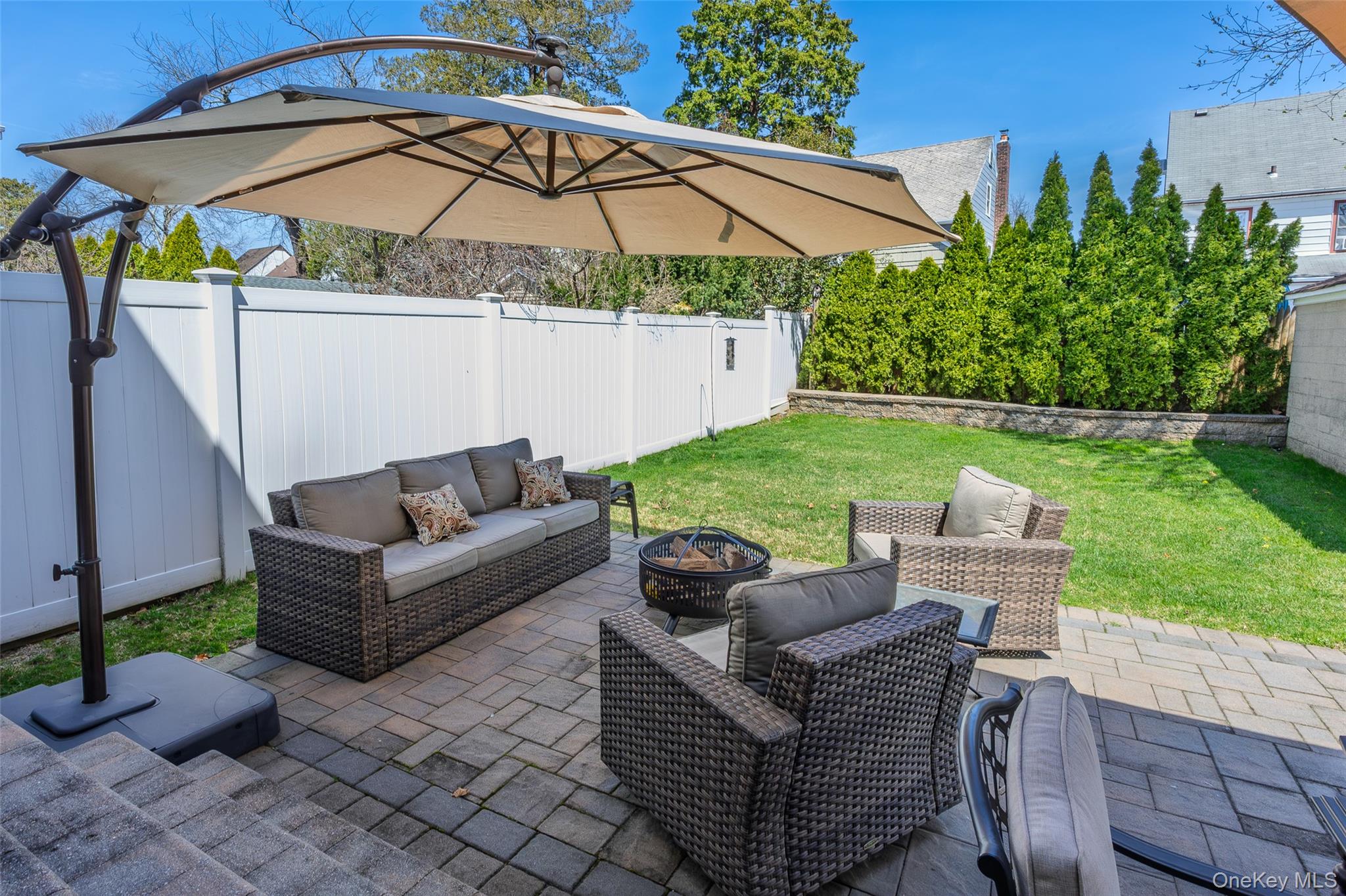 416 Argyle Road Mineola, NY 11501 - Photo 9 of 46 a view of a patio with couches under an umbrella