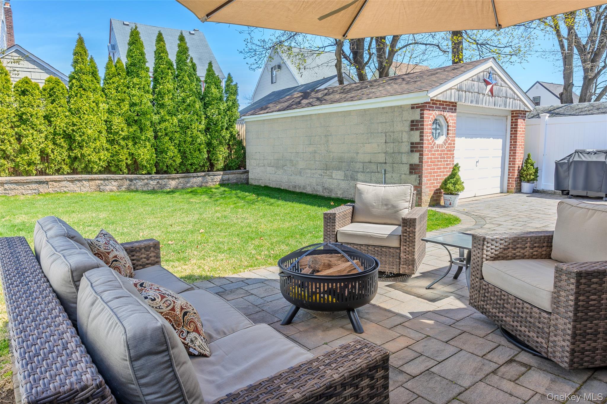 416 Argyle Road Mineola, NY 11501 - Photo 10 of 46 a view of a patio with couches chairs and a potted plant