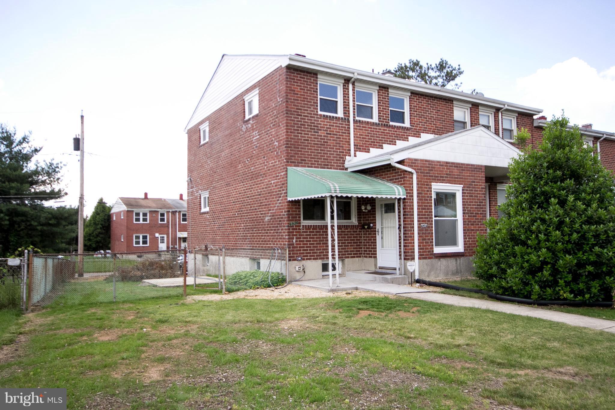 6936 Blanche Road Baltimore, MD 21215 - Photo 1 of 15 a front view of a house with a yard