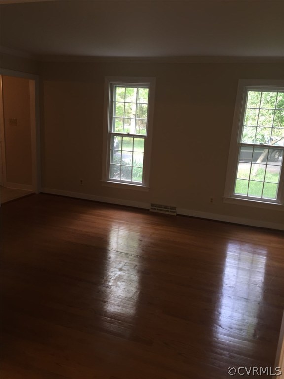 13459 Glendower Road Midlothian, VA 23113 - Photo 11 of 16 an empty room with wooden floor and windows