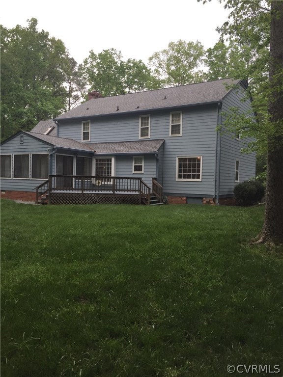 13459 Glendower Road Midlothian, VA 23113 - Photo 14 of 16 a front view of a house with a garden and trees