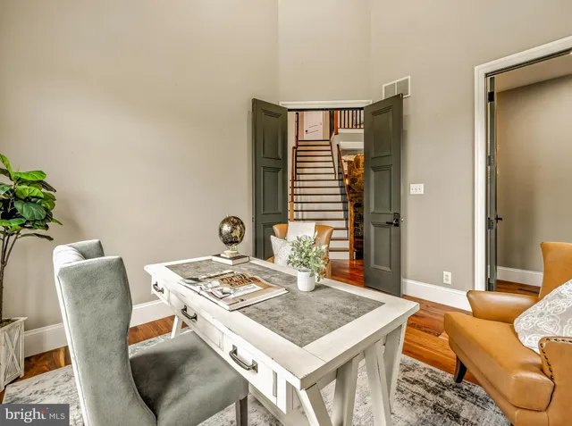 a dining room with a table and chairs