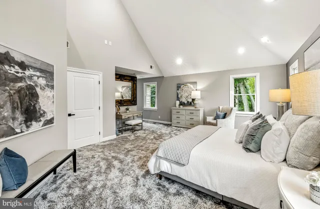 a bedroom with a bed and a couch