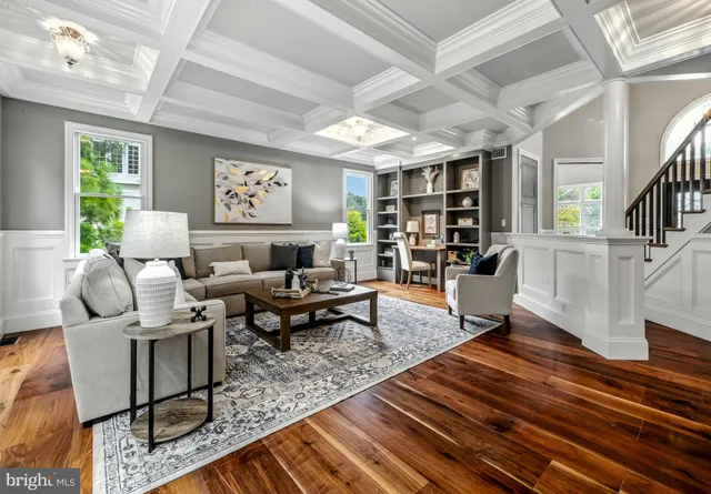 a living room with furniture lots of wooden floor