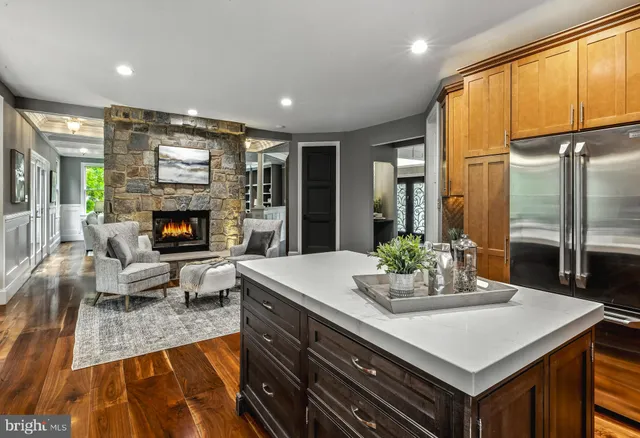a living room with fireplace furniture and a flat screen tv