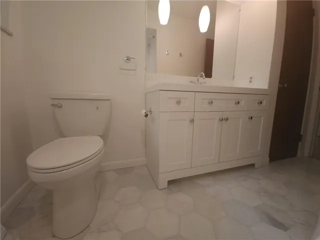 a bathroom with a bathtub and window