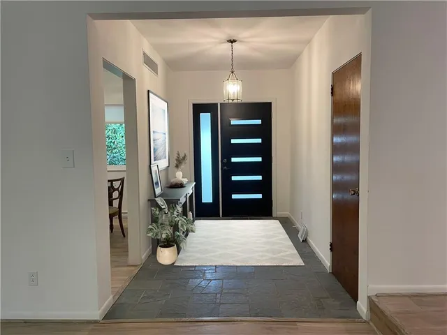 a view of entryway with livingroom and hallway
