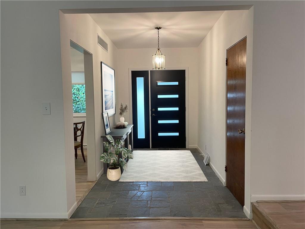 123 Gregden Road Butler, PA 16001 - Photo 2 of 18 a view of entryway with livingroom and hallway