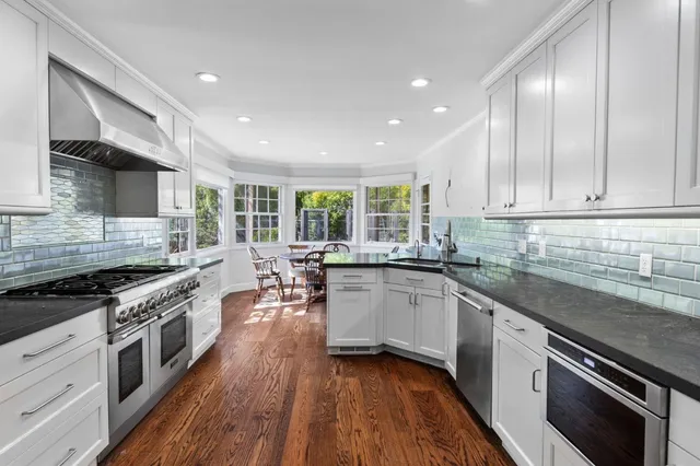 a view of a dining room with furniture and wooden floor