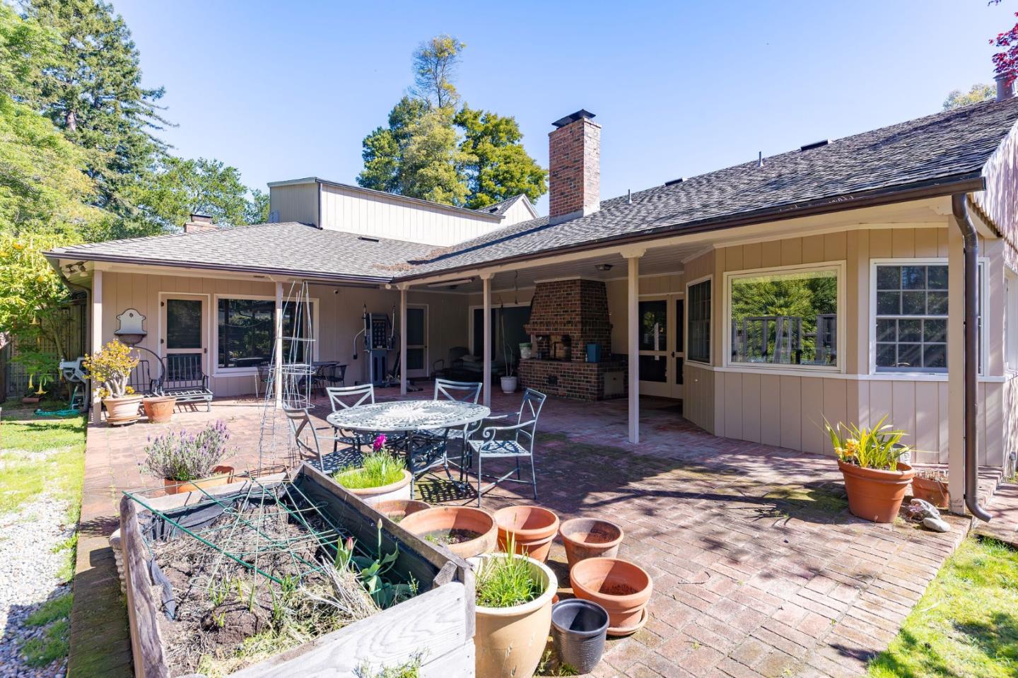 680 Fairway Circle Hillsborough, CA 94010 - Photo 27 of 83 a view of a patio with table and chairs and potted plants