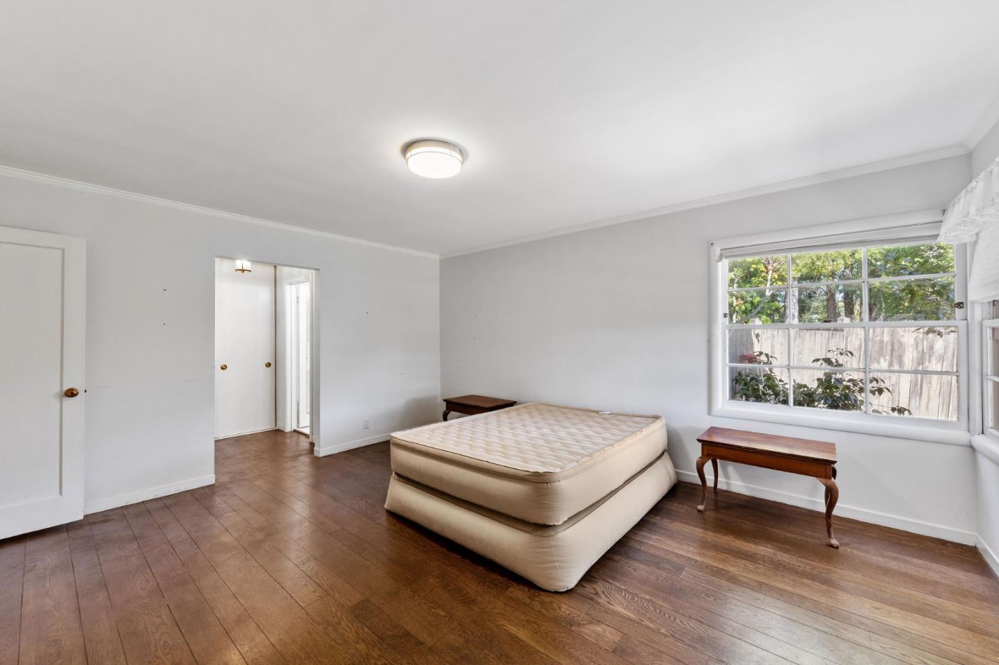 680 Fairway Circle Hillsborough, CA 94010 - Photo 34 of 83 a bedroom with a bed and a large window