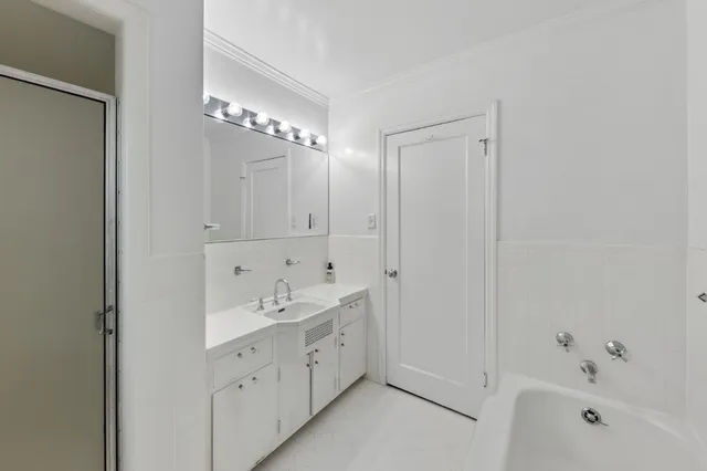 a bathroom with a bathtub and a sink