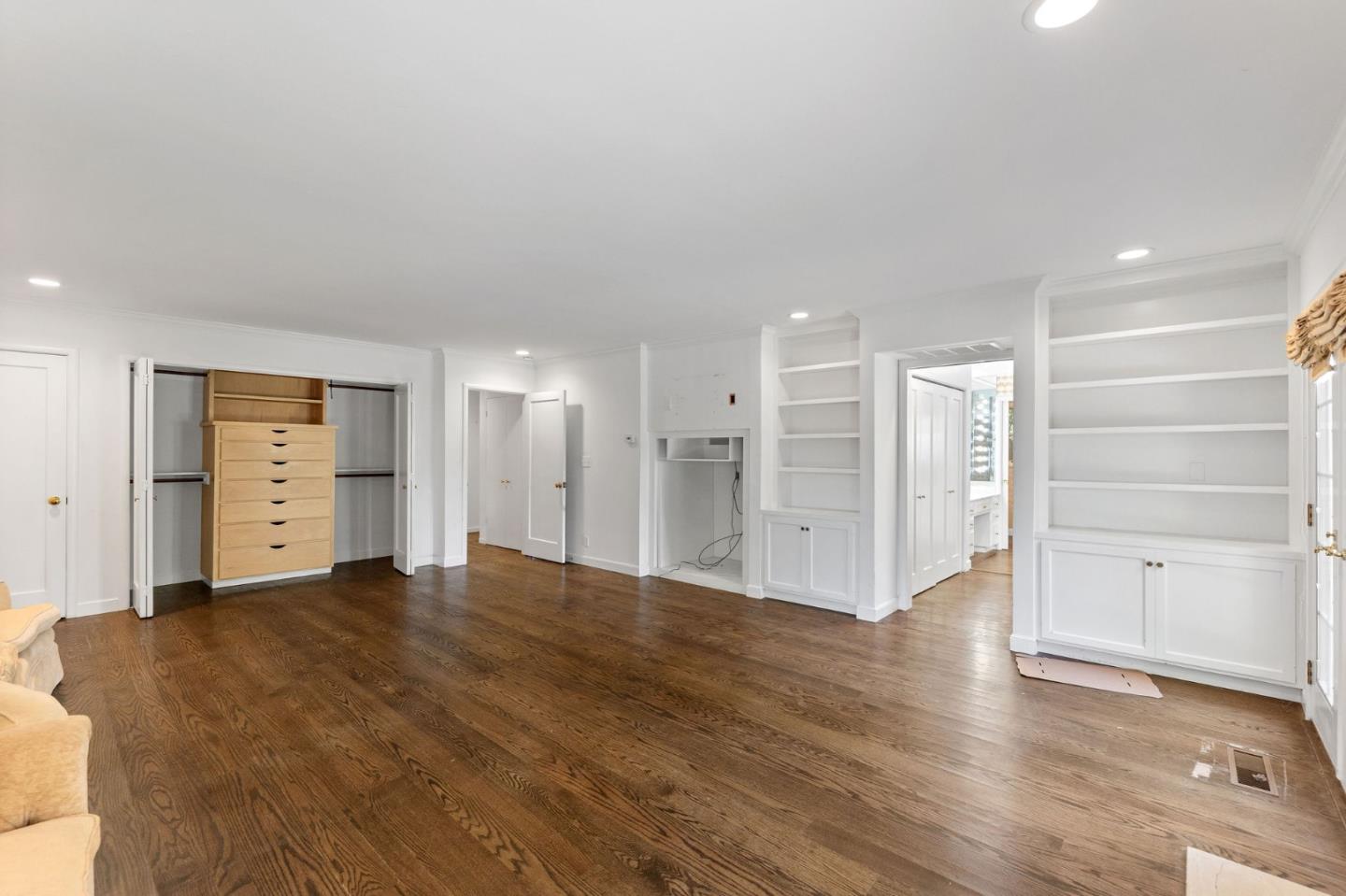 680 Fairway Circle Hillsborough, CA 94010 - Photo 61 of 83 a view of empty room with wooden floor and cabinet